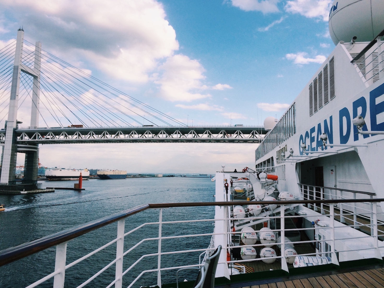 Peace Boat's Ocean Dream crossing under the Yokohama Bridge
