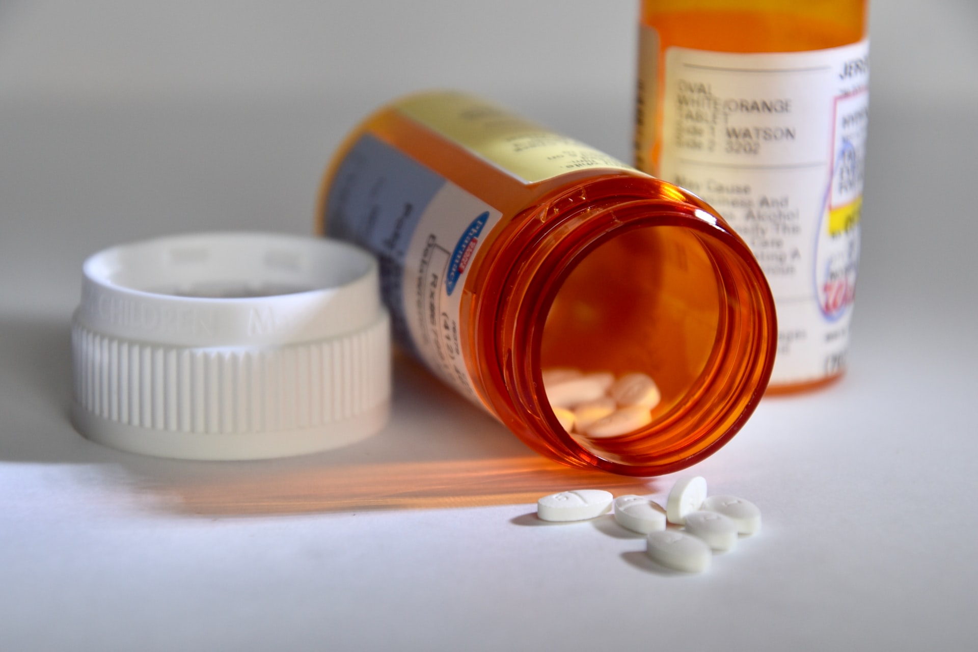 prescription medication and orange bottles