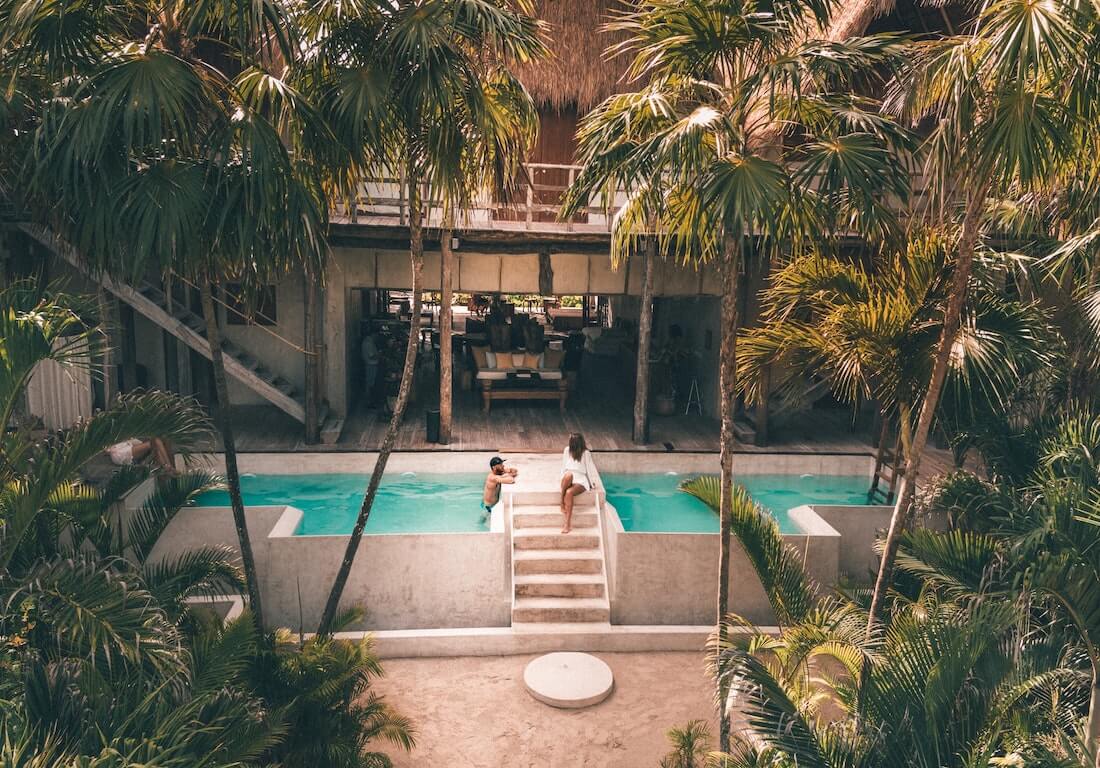 couple in pool in tulum, mexico