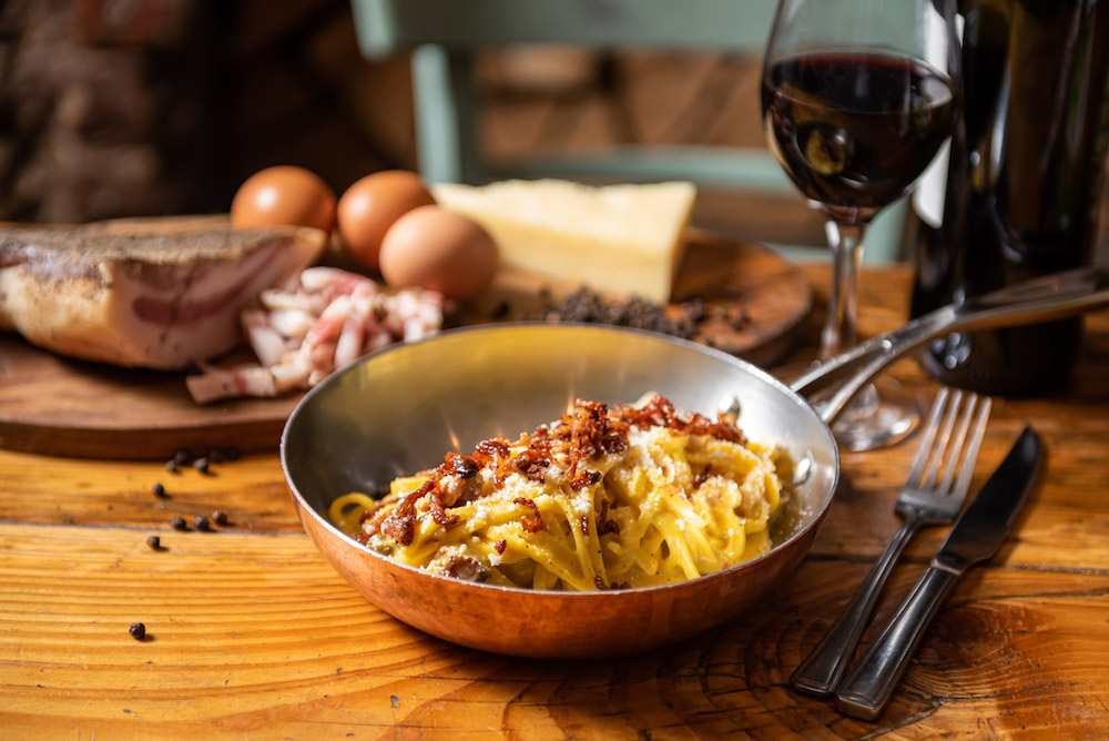 small skillet with carbonara and bacon