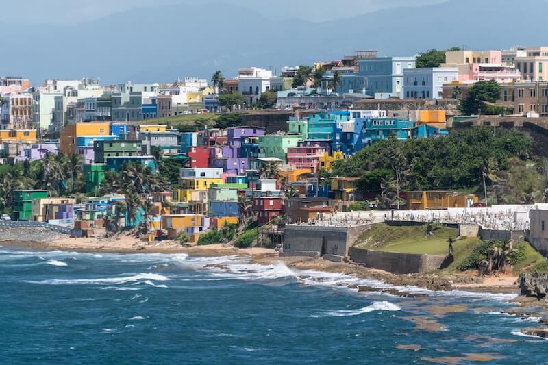 La Perla shantytown neighborhood in San Juan, Puerto Rico with colorful homes built into a hill by the water