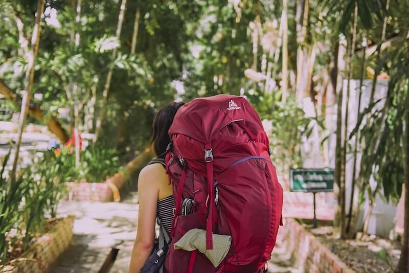 woman with a large pink backpack