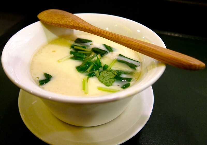 bowl of chawanmushi with a small wooden spoon