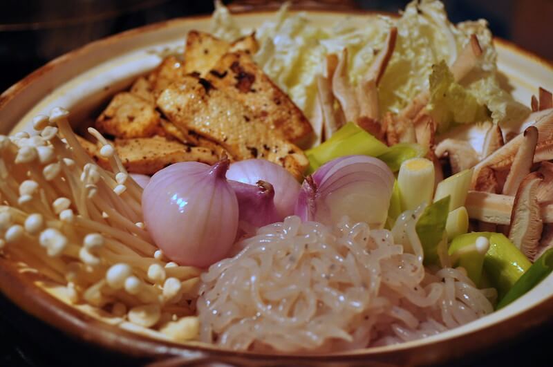 sukiyaki ingredients: vegetables, mushrooms, tofu, and konnyaku noodles