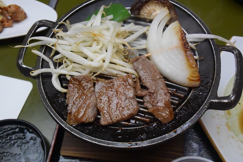 beef, beansprouts, and mushrooms grilling tableside