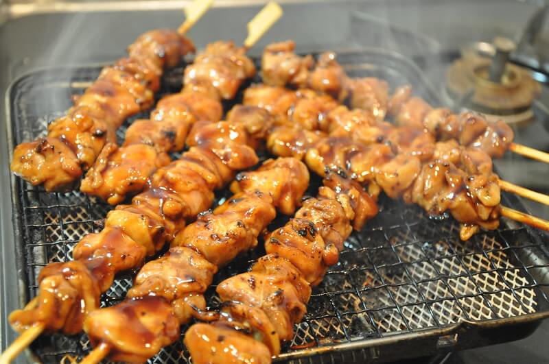 japanese food and popular street snack yakitori- grilled chicken on skewers
