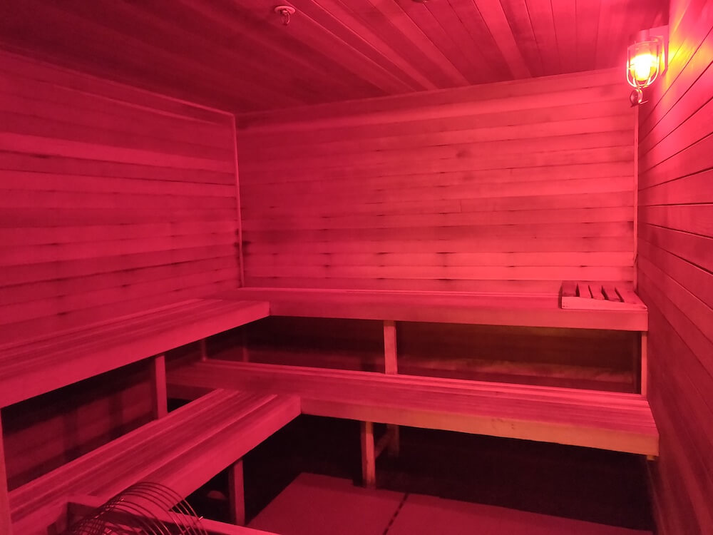 The sauna at the South Pole has three wooden seating tiers and a soft red light