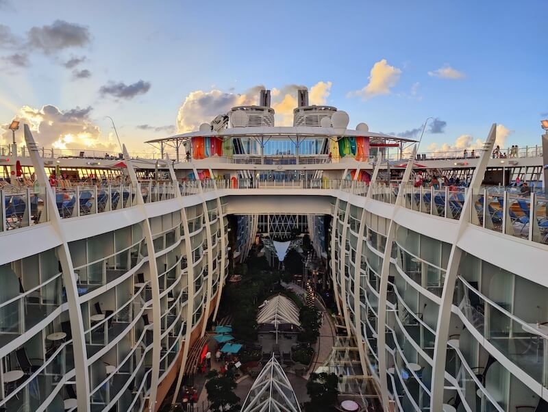 Sunset view of Symphony of the Seas looking down from the open pool deck into Central Park