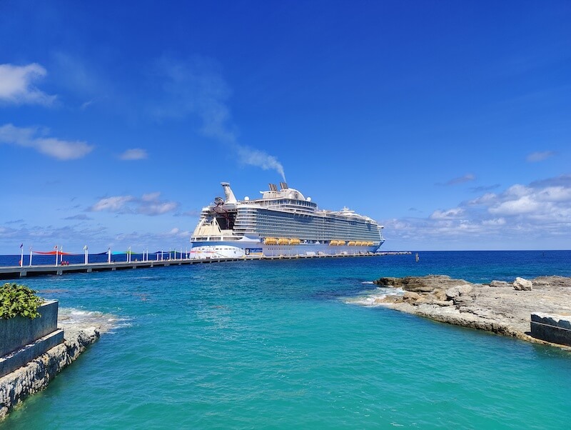 Symphony of the Seas docked in Perfect Day at Cococay, Bahamas, surrounded by turqoise waters