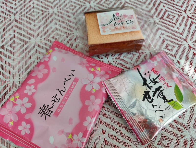 Sakura-themed items from the Tokyo Treat box review: senbei rice crackers and castella cake