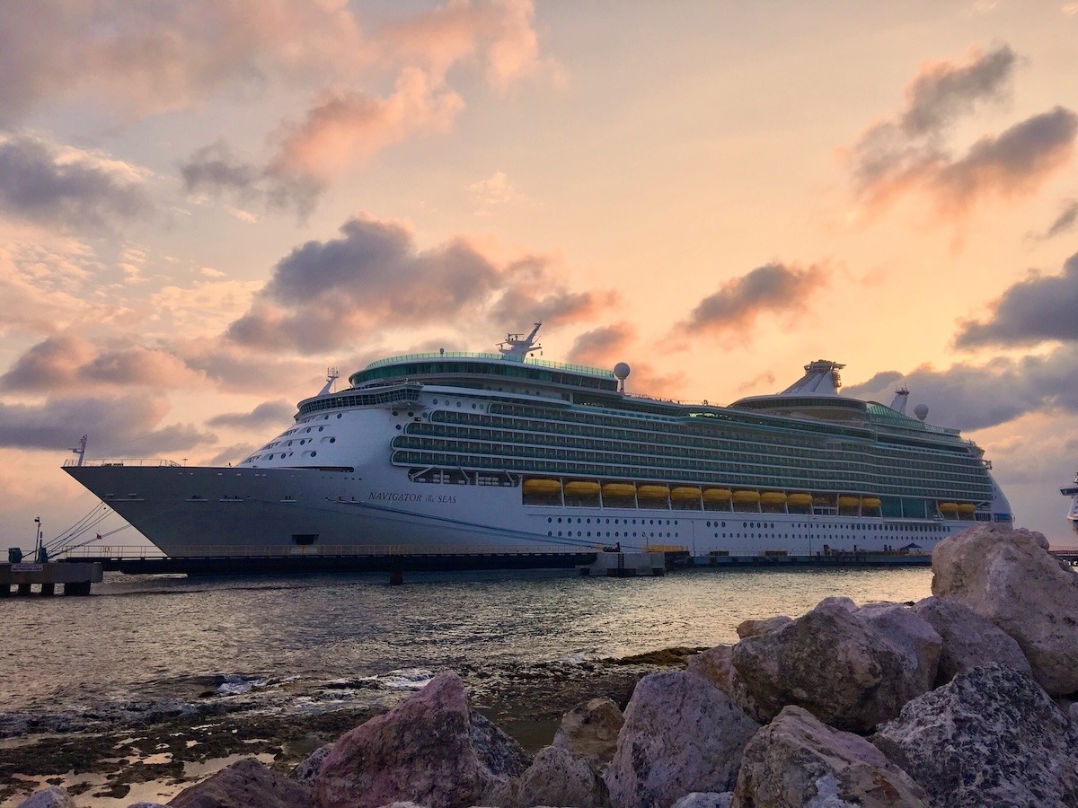The Navigator of the Seas docked during sunset.