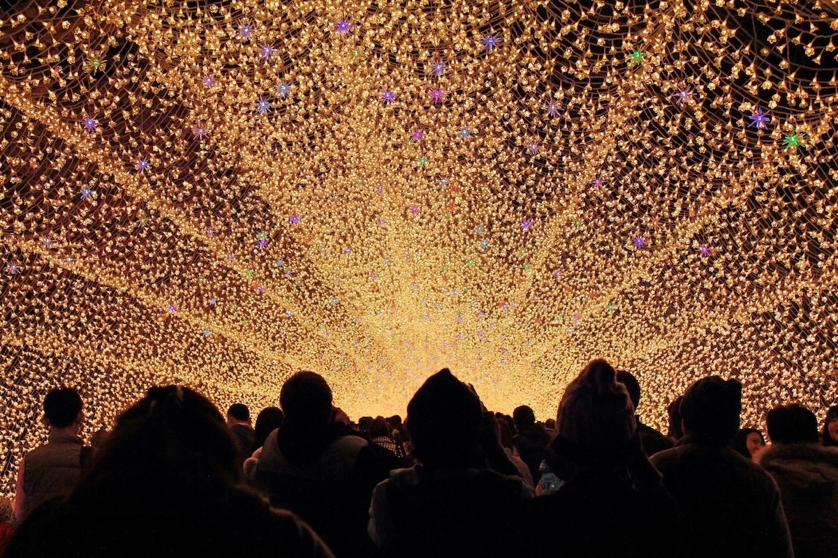 Nabana no sato winter illumination light tunnel in Japan that people are walking through