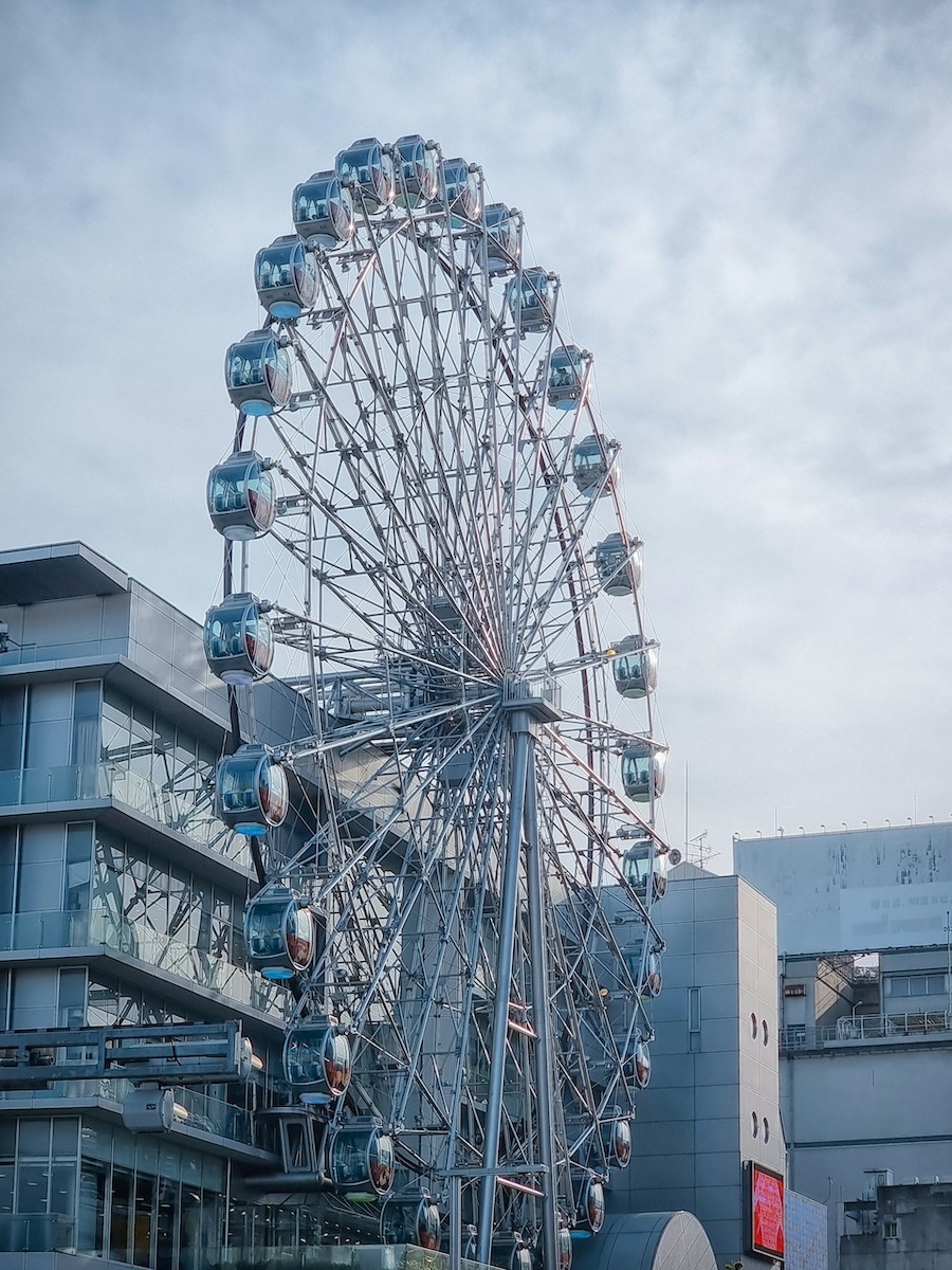 A ferris wheel attached to the side of a building in Nagoya, Japan