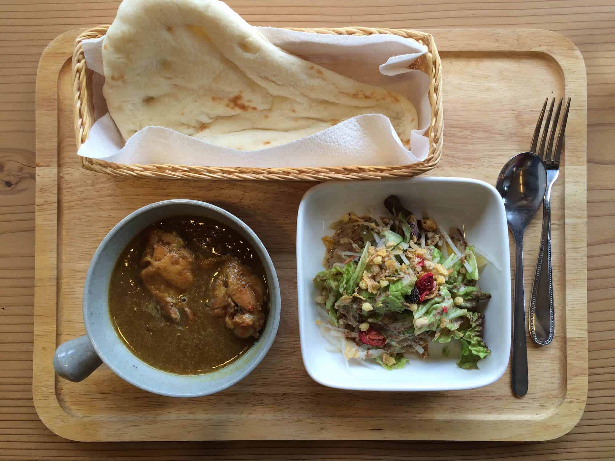 Naan, curry, and salad