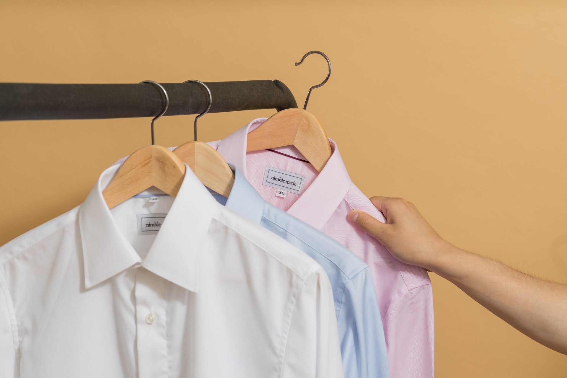white, light blue, and light purple button down collared shirts