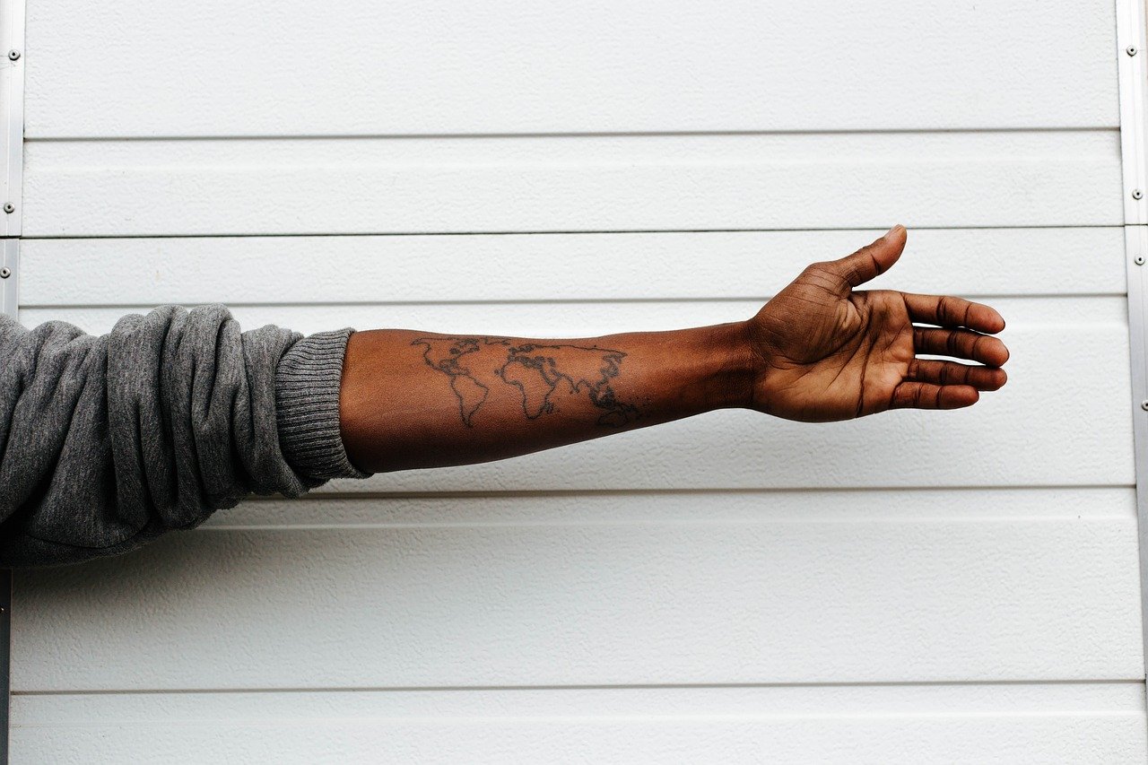 map tattoo on forearm