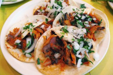 Four tacos al pastor with onions and cilantro at El Fogon tacqueria in Playa del Carmen