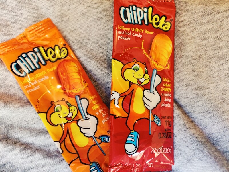 Mexican candy Chipileta lollipops in orange and chamoy