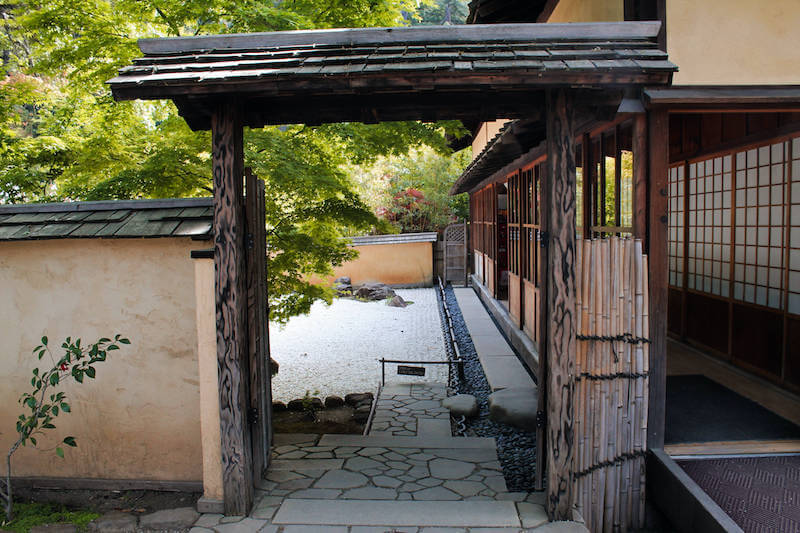 Japanese garden entrance with dry rock garden in background