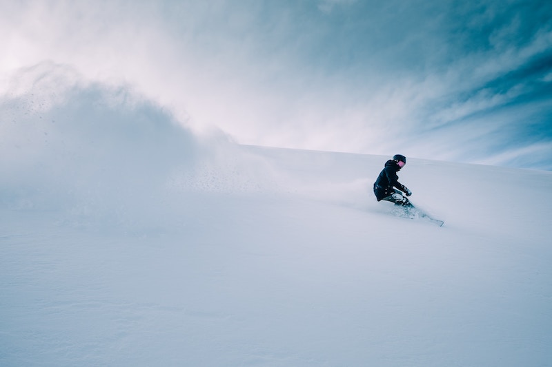 A person snowboarding down a slope